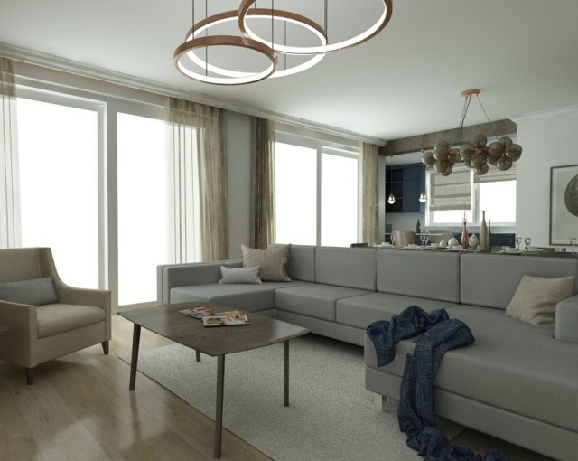 Obývacia izba a veľký béžový gauč v modernom štýle, zaujímavé svietidlá